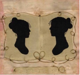 A pair of silhouetted female profiles presented in black against a background of cream-colored paper face each other. The artwork is framed in silk and braided human hair, which forms a delicate heart shape between the two dark shapes.